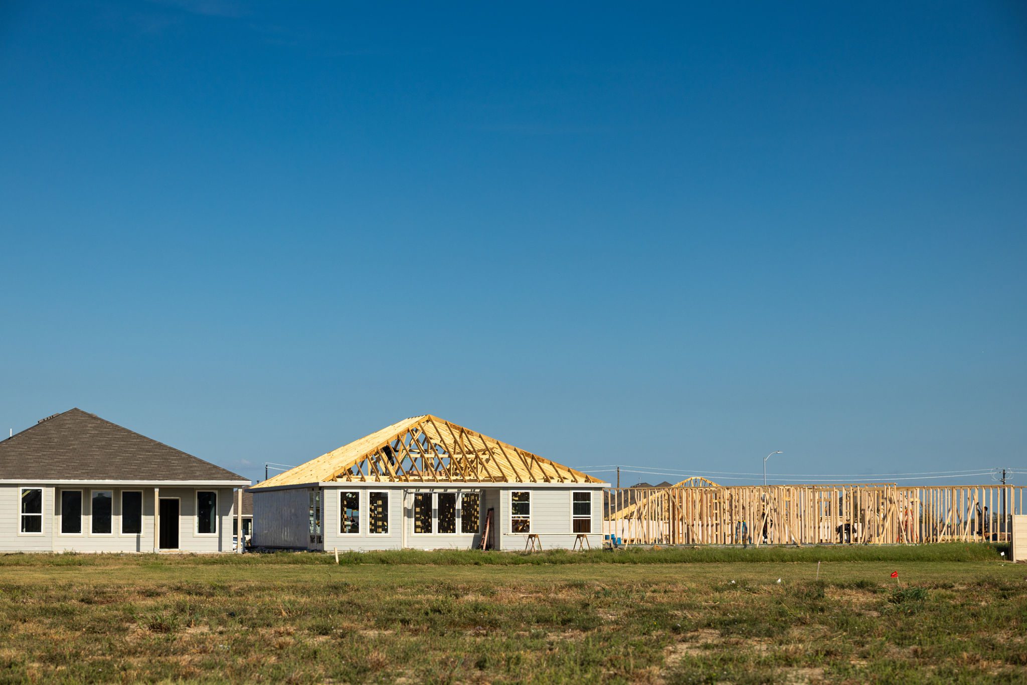 Framed house against blue sky