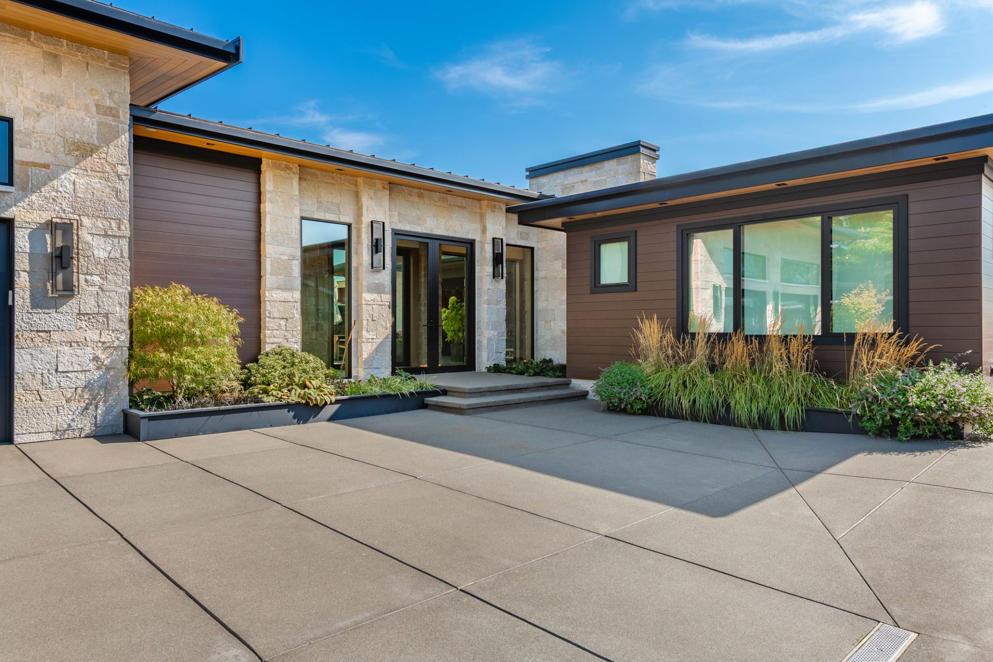 Contemporary home entrance with plants