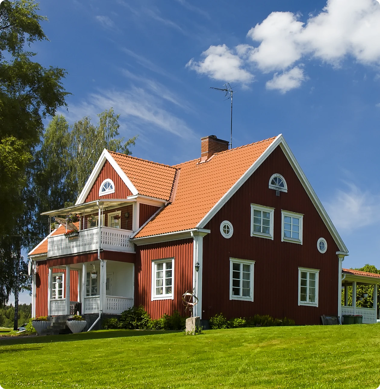 Charming rural house with lush green lawn